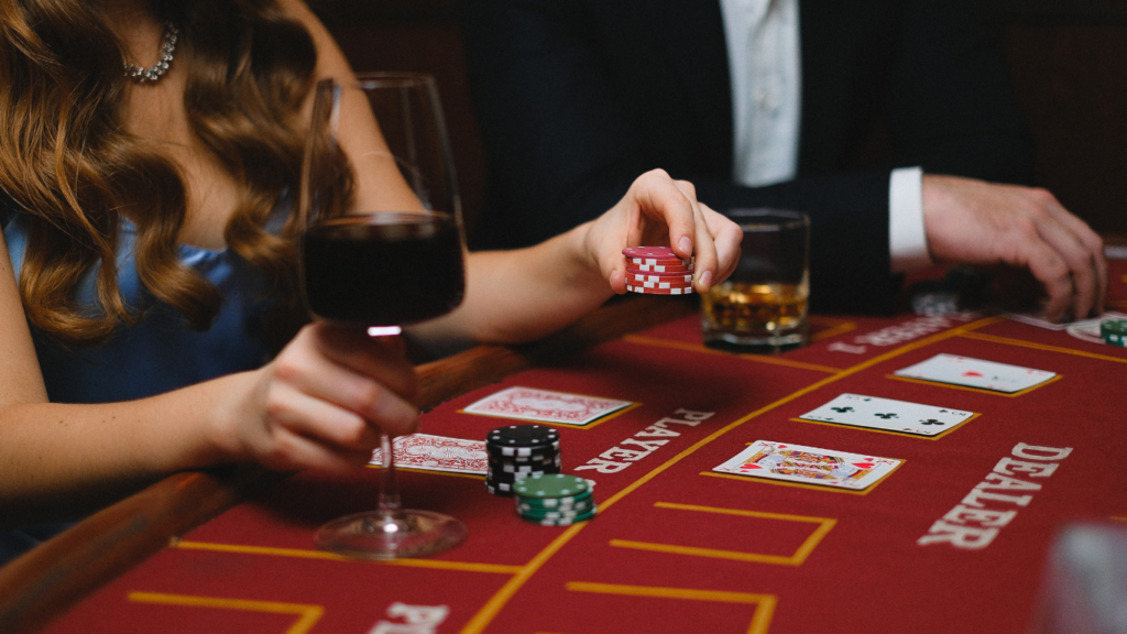 Two people playing blackjack at a casino table