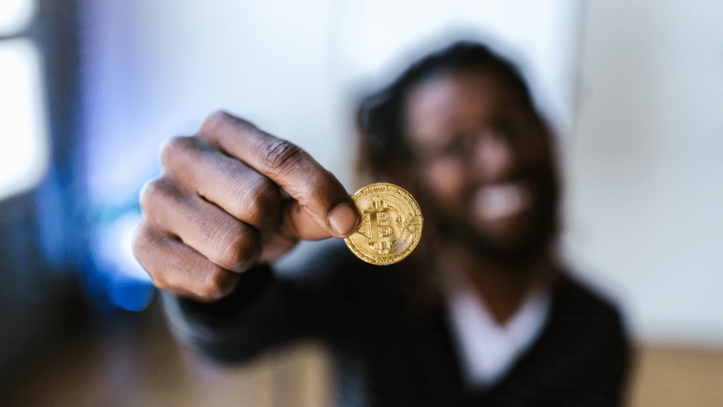 a person holding a gold coin