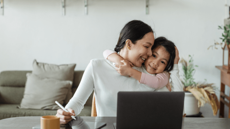 two person in front of laptop