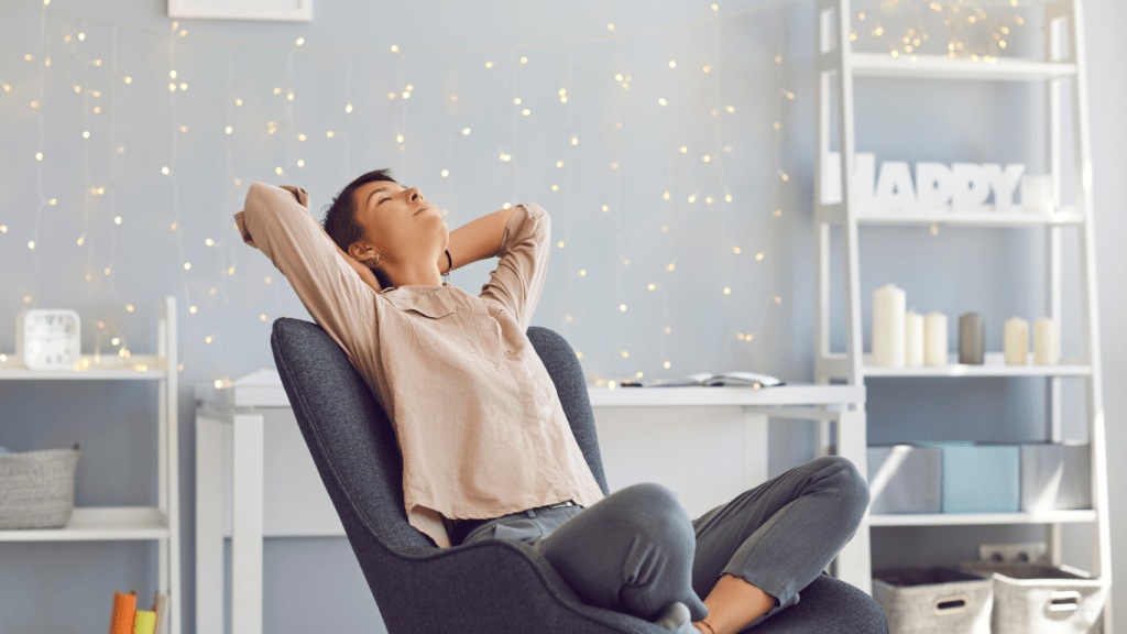 a person is relaxing in a chair in their living room