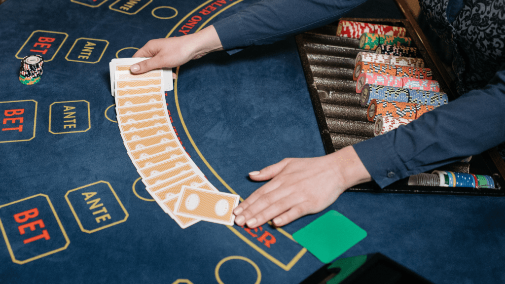 a casino table with several people playing blackjack