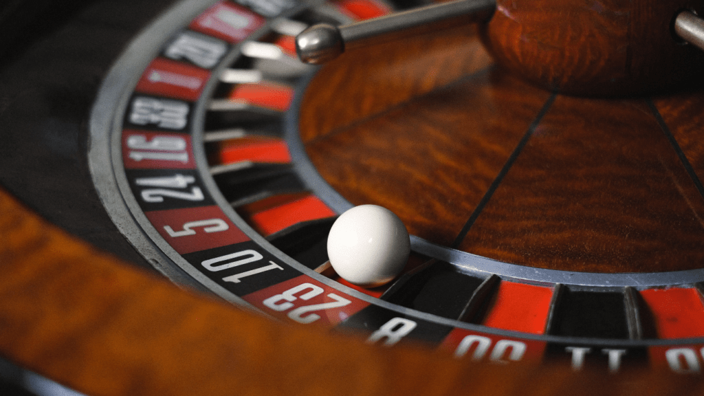 a close up of a roulette wheel on a casino table