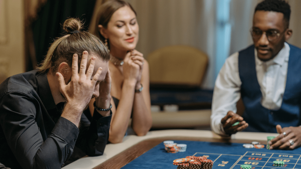 a group of people playing roulette at a casino table