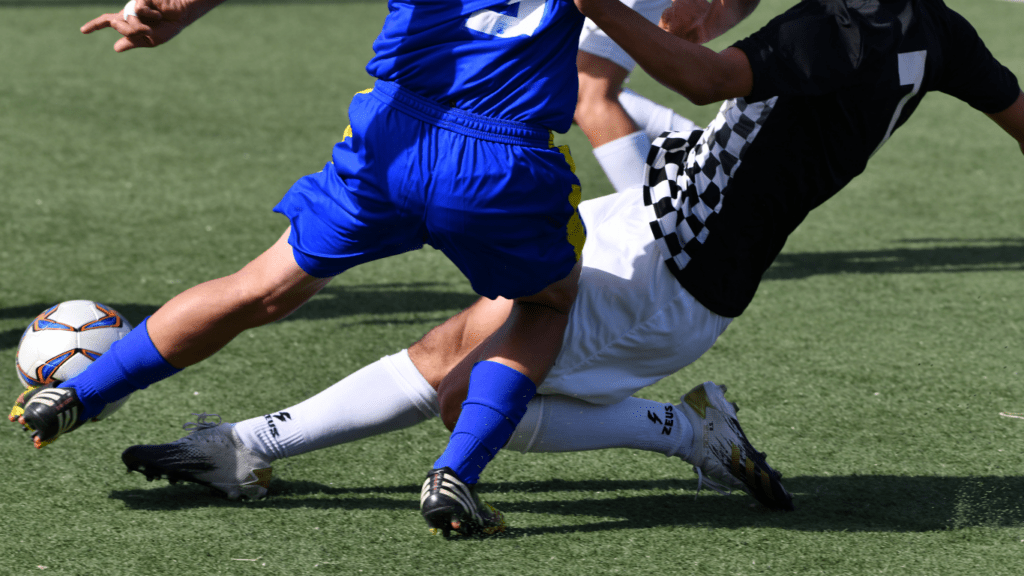 a group of people playing soccer on a field