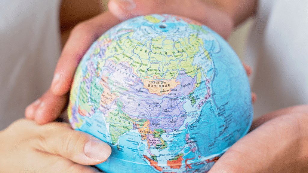 a person holding a globe