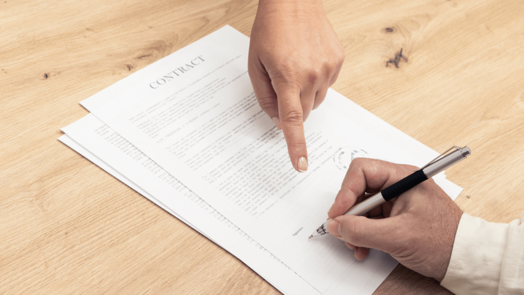 a person signing a contract