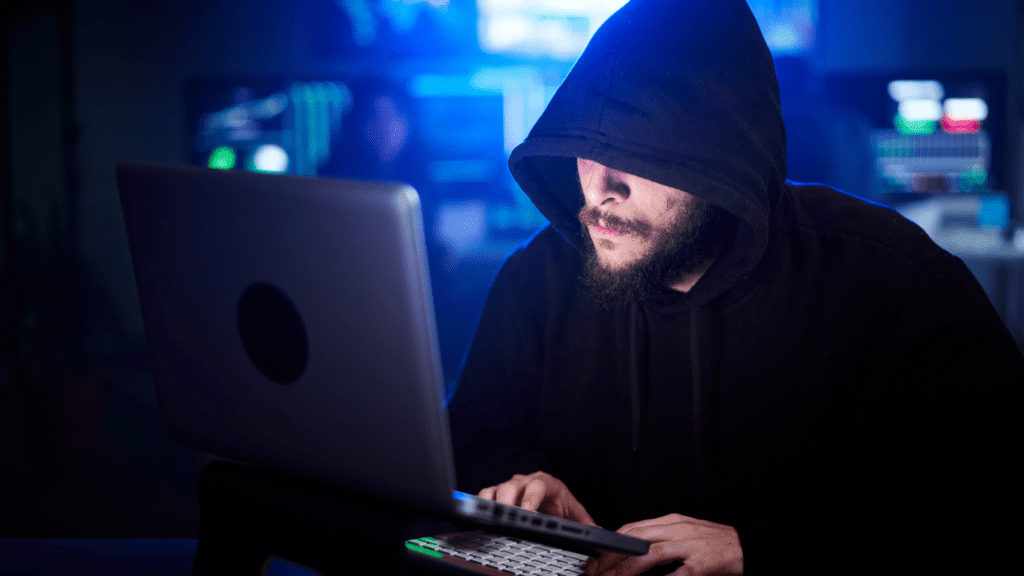 a person typing on a laptop computer